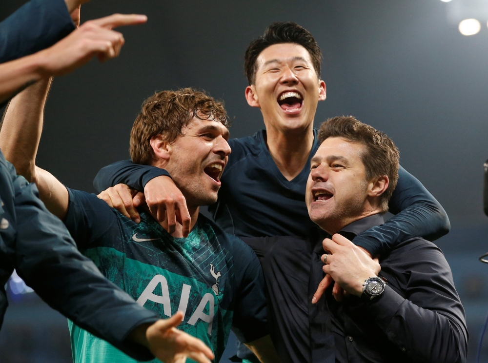 
Tottenham manager Mauricio Pochettino, Fernando Llorente and Son Heung-min celebrate after the match. Reuters/Andrew Yates

 
