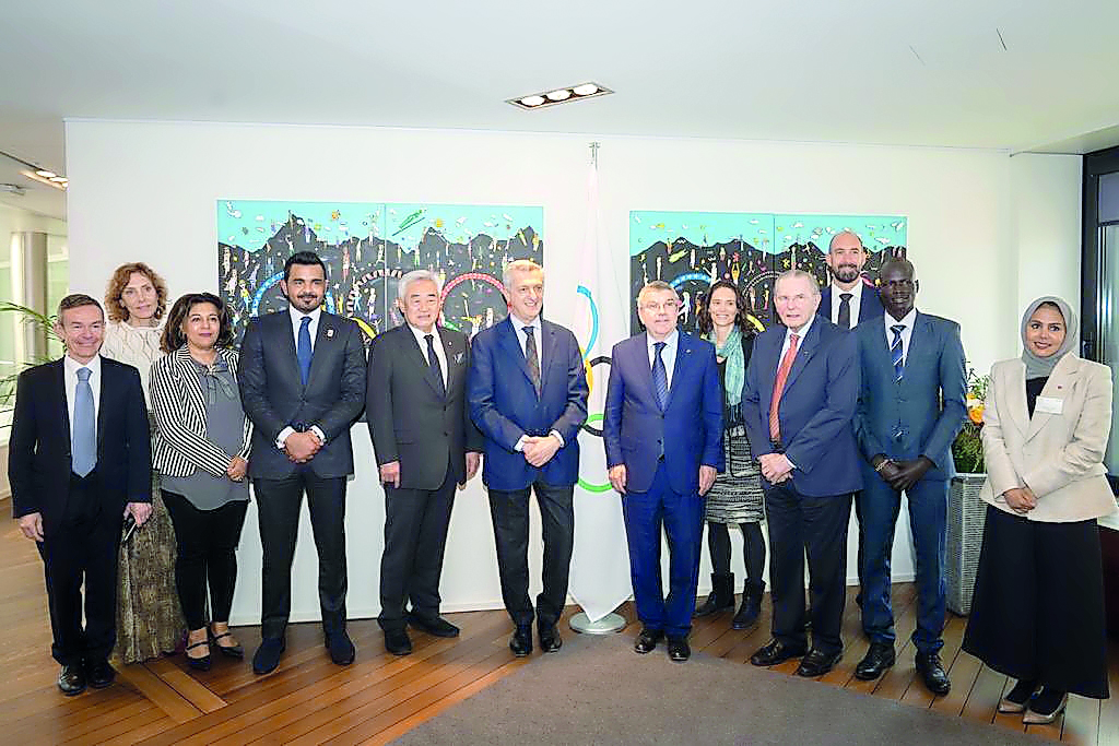 H E Sheikh Joaan poses for a group photo with other officials. 