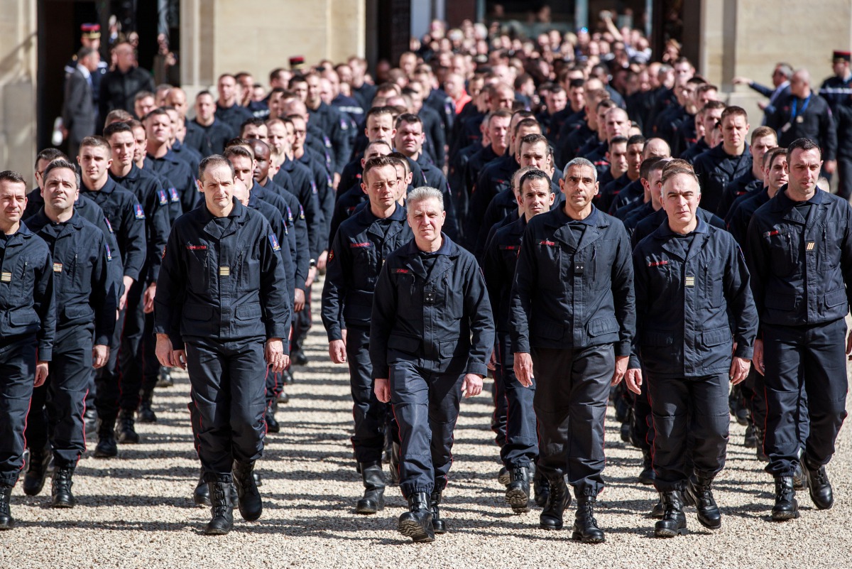 Parisian Firefighters' brigade arrives at Elysee Palace to attend a speech of the French President Emmanuel Macron, to pay tribute to the firemen who took part at the fire extinguishing's operations during the Notre Dame of Paris Cathedral fire, in Paris,