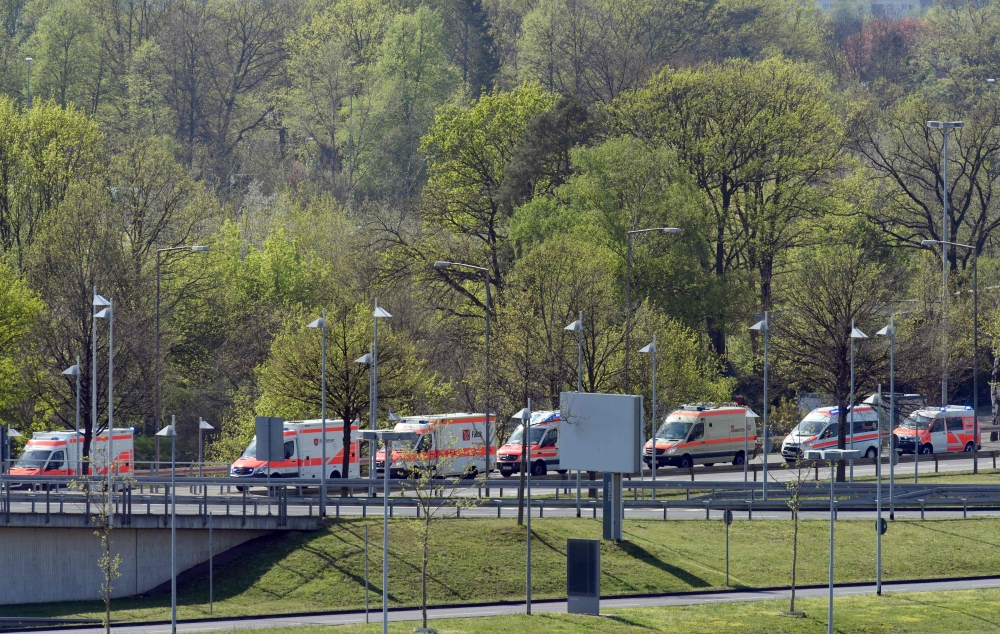 Ambulance vehicles are pictured nearby the military part of Cologne Bonn Airport western Germany, on April 20, 2019. AFP / Caroline Seidel