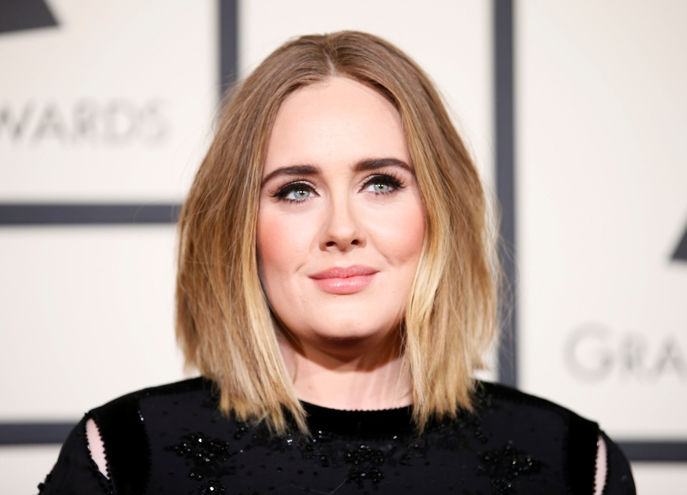 FILE PHOTO: Singer Adele arrives at the 58th Grammy Awards in Los Angeles, California February 15, 2016. REUTERS/Danny Moloshok
