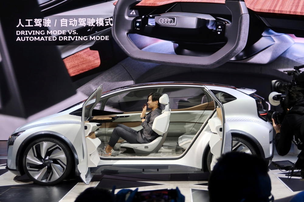 A designer presents an Audi AI:me concept car during an unveiling event in Shanghai, China April 15, 2019. Reuters/Norihiko Shirouzu