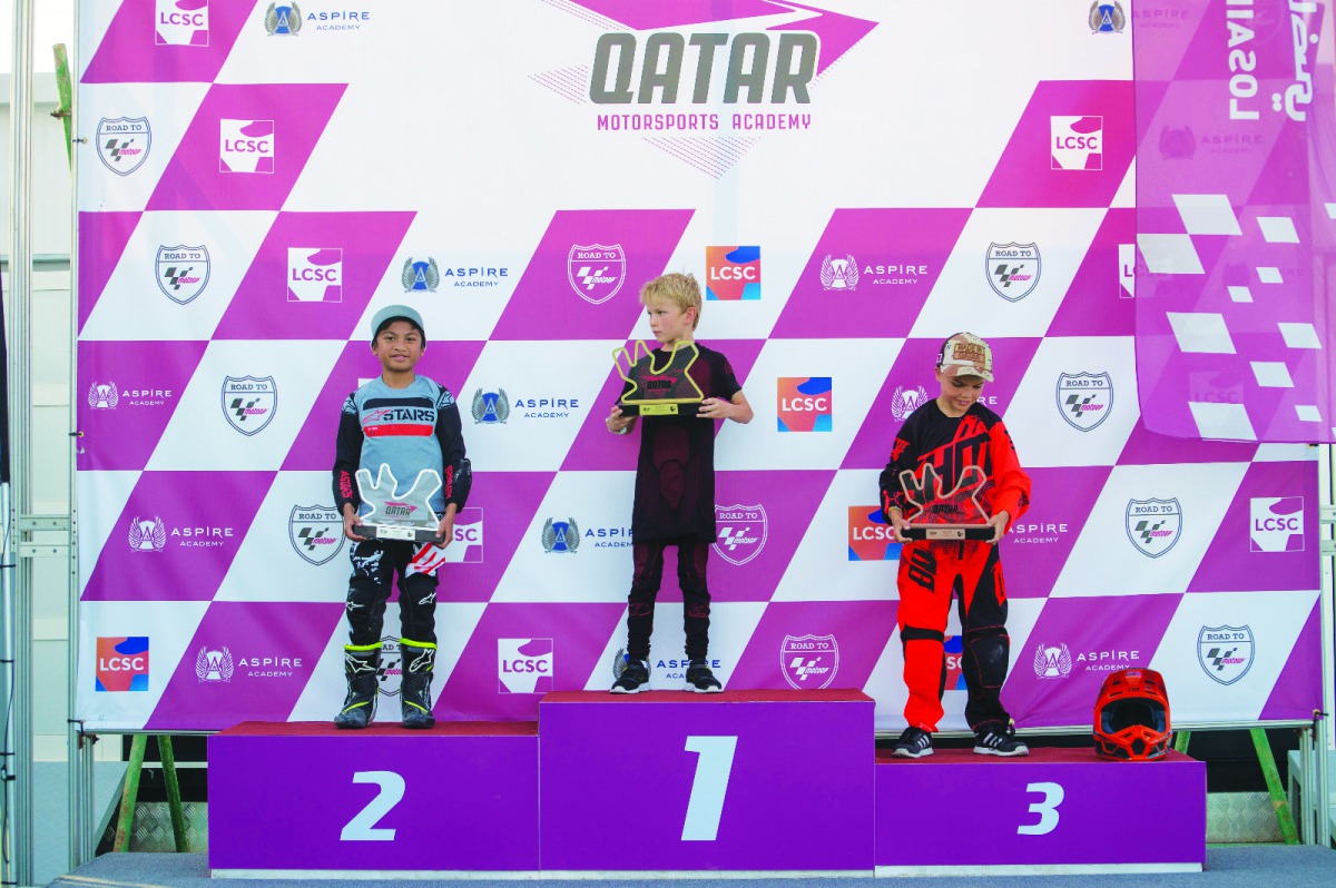 The podium winners of the Flat Track 70cc category of the End Season Off Road Race conducted by the Qatar Motorsports Academy (QMA), pose for a photograph on Saturday.