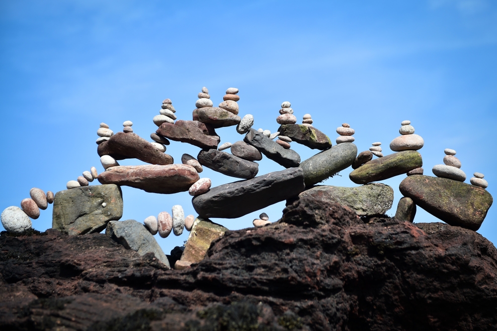 A picture shows a balanced sculpture built during the European Stone Stacking Championships 2019 in Dunbar, Scotland, on April 21, 2019. AFP / Andy Buchanan