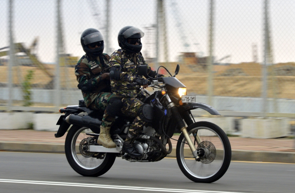 Two soldiers on a motorbike patrol along a street in Colombo on April 25, 2019, following a series of bomb blasts targeting churches and luxury hotels on the Easter Sunday in Sri Lanka. AFP / Ishara S Kodikara 