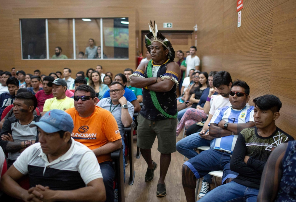 Xipaya indigenous chief Leo Xipaya walks as he waits before a meeting of indigenous leaders of tribes of the Xingu area with representatives of the Brazilian federal government at the Brazilian National Indigenous Foundation (FUNAI) headquarters, in Altam