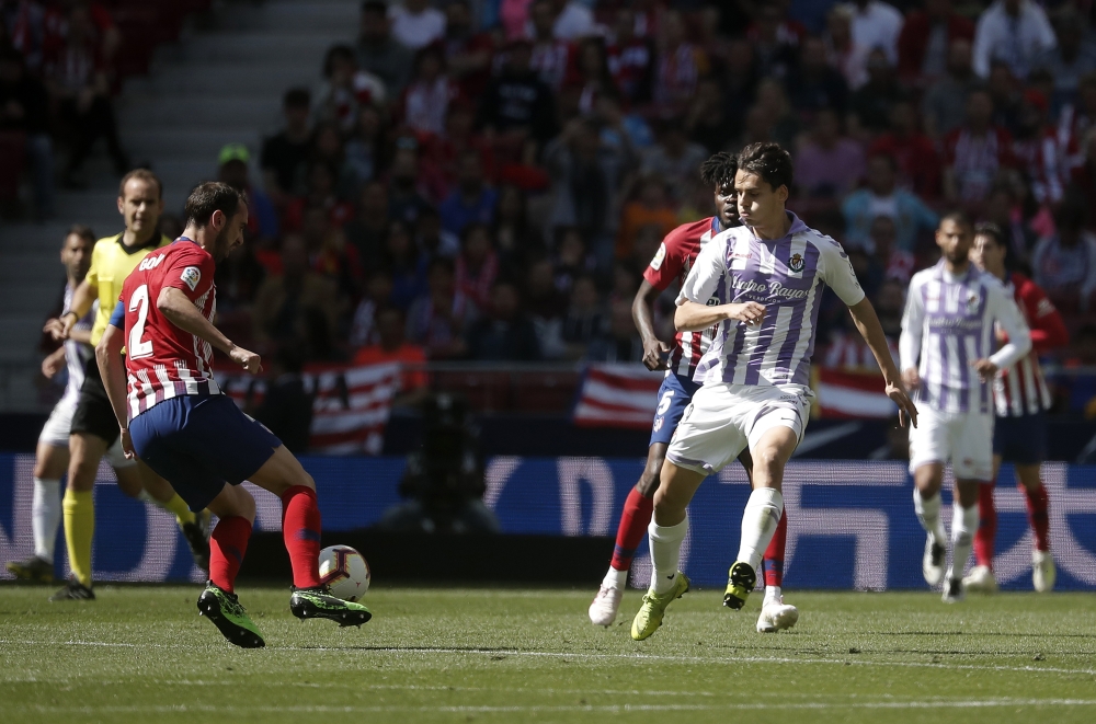 Enes Unal (R) of Valladolid in action against Diego Godin (L) of Atletico Madrid during the La Liga soccer match between Atletico Madrid and Valladolid at the Wanda Metropolitano Stadium in Madrid, Spain on April 27, 2019. Burak Akbulut - Anadolu