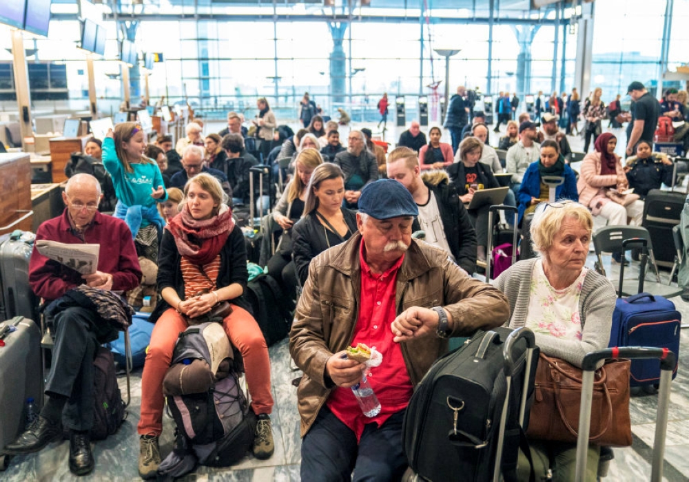 People wait as SAS pilots go on strike at Oslo Airport in Gardermoen, Norway April 26, 2019. NTB Scanpix/Ole Berg-Rusten via REUTERS