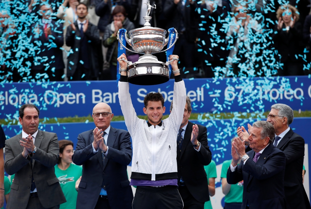 Austria's Dominic Thiem celebrates with the trophy after winning the Barcelona Open REUTERS/Albert Gea
