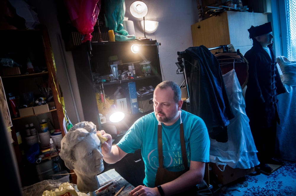 Roman Bajzik (48) works on a wax figurine of Empress Elisabeth of Austria, better known as Sissi in his flat in Bratislava, Slovakia on April 10, 2019.  AFP / Vladimir Simicek 