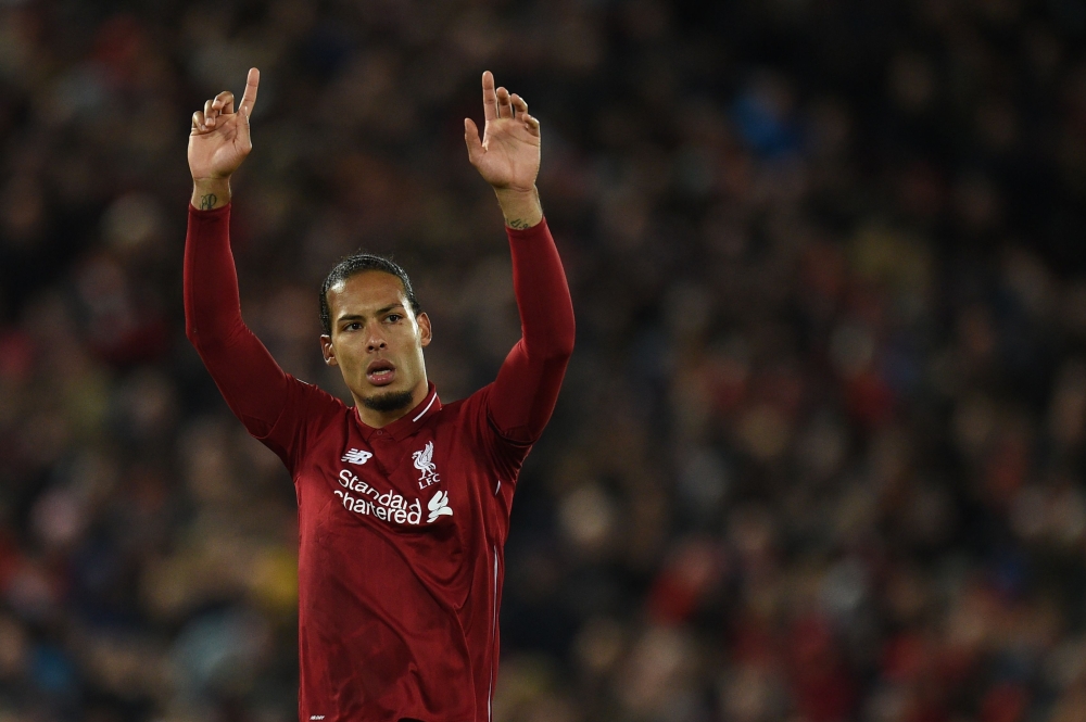 Liverpool's Dutch defender Virgil van Dijk acknowledges supporters during the English Premier League football match between Liverpool and Huddersfield at Anfield in Liverpool, north west England on April 26, 2019. AFP / Oli Scarff 