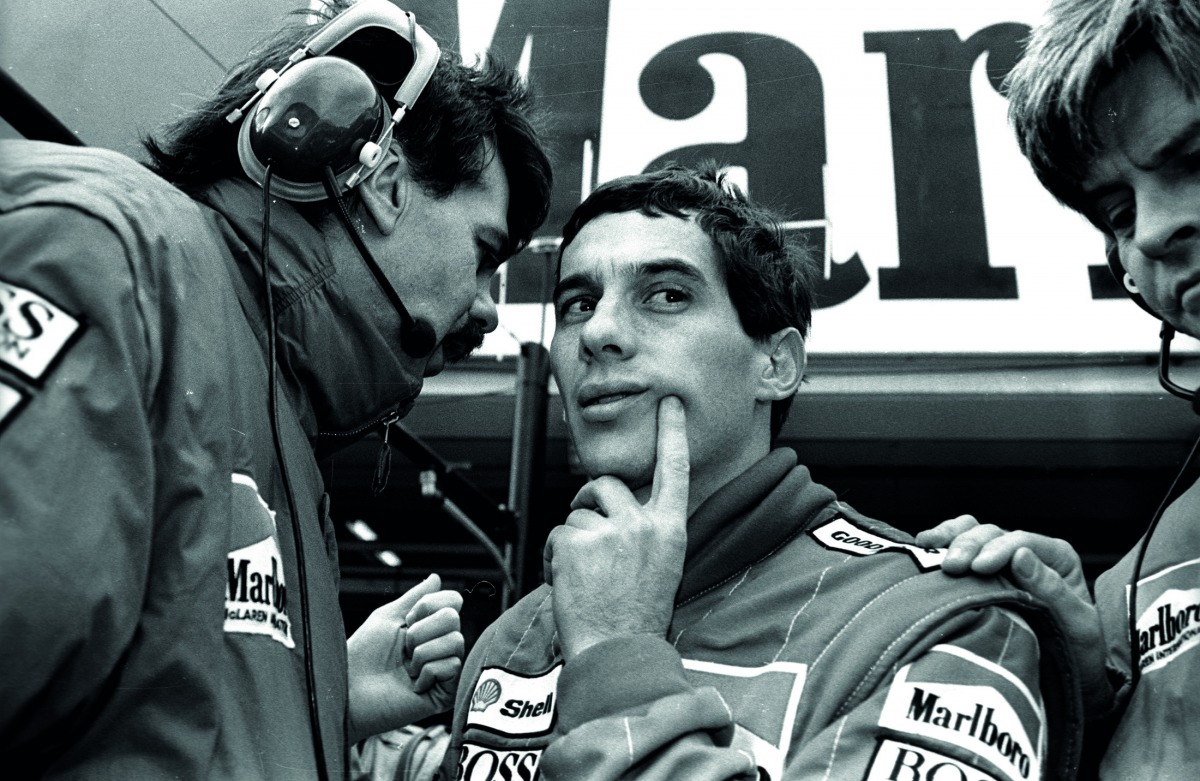  Ayrton Senna of Brazil talks with his McLaren team member during the final practice session for Sunday's Japanese Grand Prix in Suzuka October 29, 1988.  Reuters/Masaharu Hatano