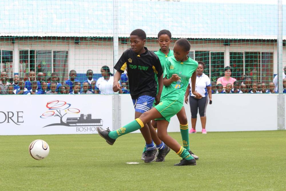 Students play football on a GreenSource field in South Africa which filters 17 million litres of clean water per year. Photo taken on 22 April 2019. Handout photo courtesy of GreenSource