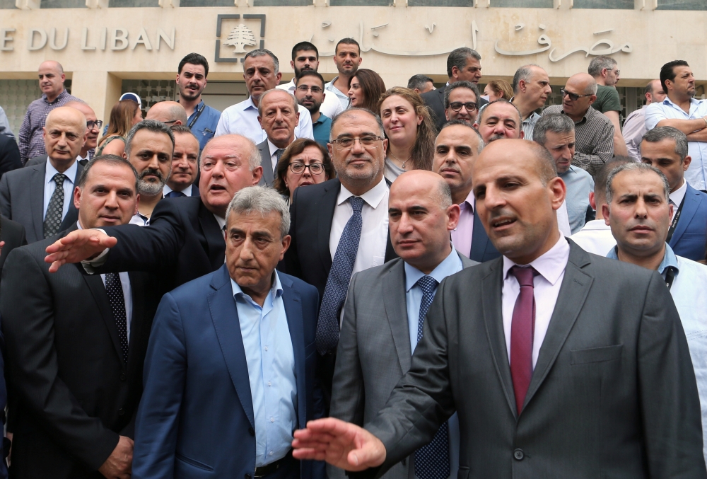 Employees of the Lebanese central bank gather during a strike over state budget proposals that would cut their benefits, in front of the central bank in Beirut, Lebanon May 6, 2019. REUTERS/Mohamed Azakir