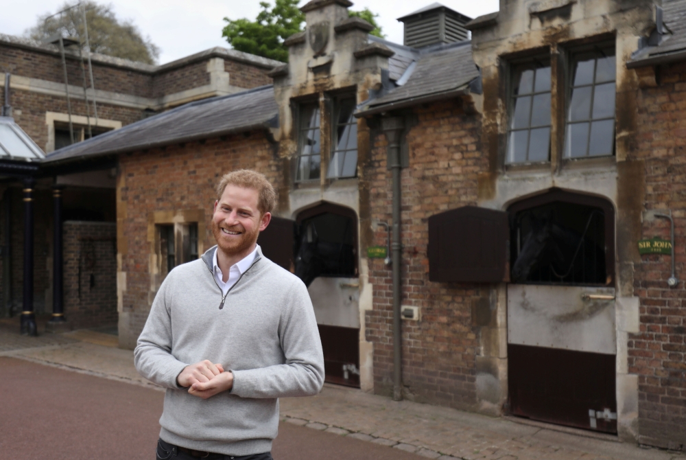 Britain's Prince Harry smiles as he speaks to the media after Meghan, Duchess of Sussex, gave birth to a baby boy, at Windsor Castle, Berkshire county, Britain May 6, 2019. Steve Parsons/Pool via REUTERS