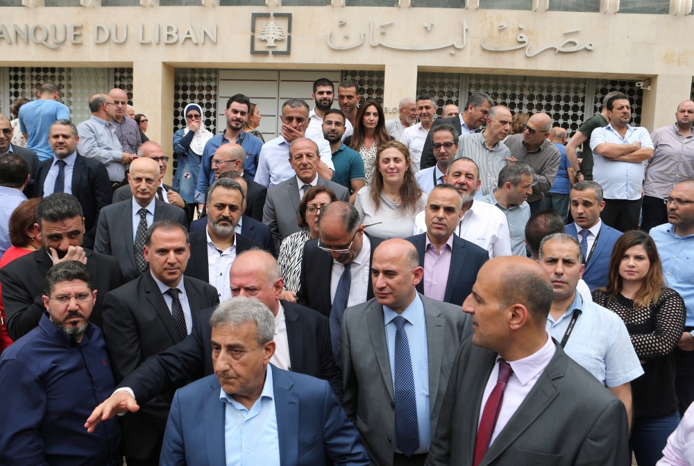 Employees of the Lebanese central bank gather during a strike over state budget proposals that would cut their benefits, in front of the central bank in Beirut, Lebanon May 6, 2019. REUTERS/Mohamed Azakir