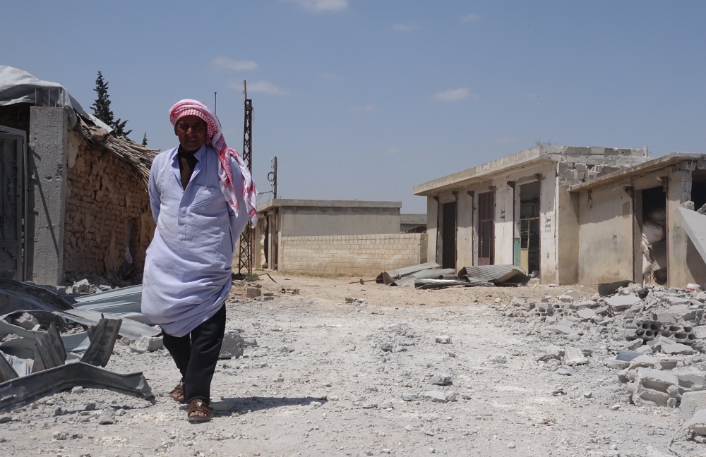 A Syrian man inspects the totally destroyed building after an attack by Assad regime forces on residential areas located inside northern Syria’s de-escalation zones, at Ras al-Ayn town of Saraqib district in Idlib, Syria on May 07, 2019. ( Hasan Muhtar - 