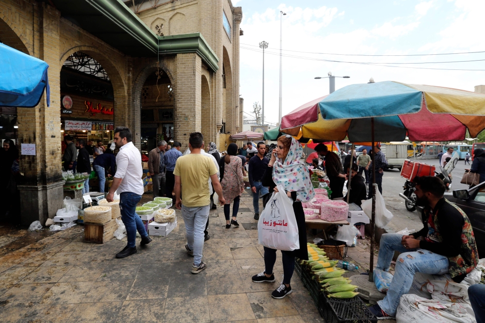 Iranians shop for ingredients on the third day of the holy Muslim month of Ramadan in northern Tehran on May 8, 2019.  AFP / Atta Kenare 
