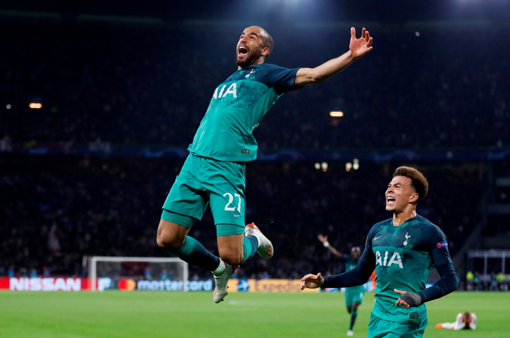 Tottenham's Lucas Moura celebrates scoring their third goal to complete his hat-trick with Dele Alli.  (Action Images via Reuters/Matthew Childs)