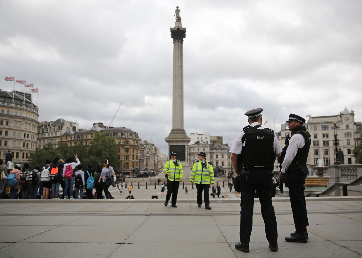 Armed police personnel patrol in London's Trafalgar Square on August 4, 2016. AFP