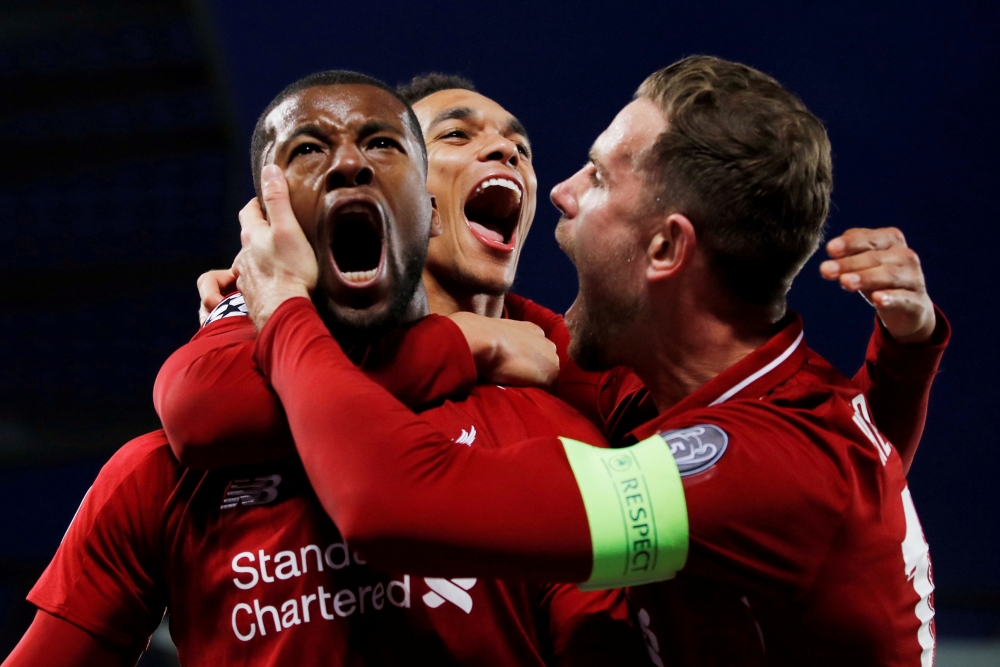 Liverpool's Georginio Wijnaldum celebrates scoring their third goal with Jordan Henderson and Trent Alexander-Arnold REUTERS/Phil Noble/File Photo