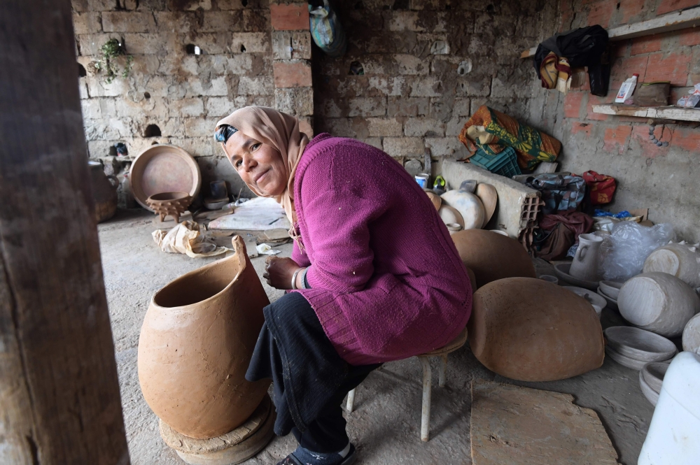 Sabiha Ayari, a Tunisian potter in her fifties, works in the village of Sejnane in the northern Tunisian province of Bizerte, about 120 kilometres (75 miles) west of the capital Tunis, on March 14, 2019. AFP / Fethi Belaid 