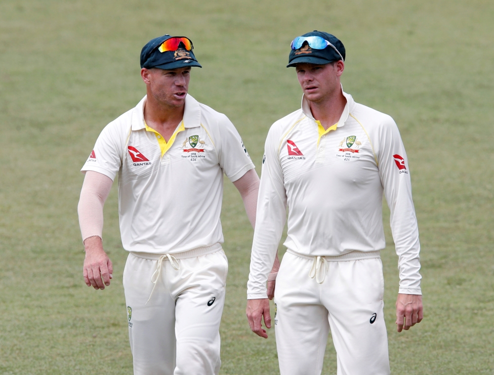 Australia's David Warner and Steve Smith leave the pitch after beating South Africa. REUTERS/Rogan Ward/File Photo