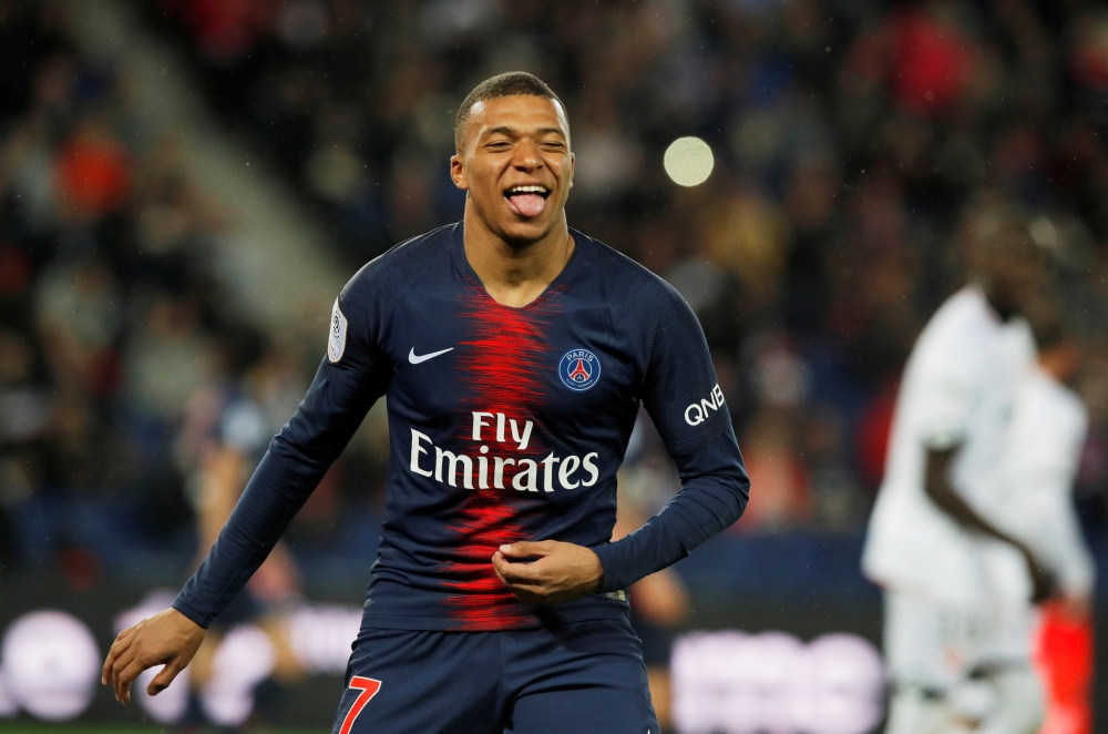FILE PHOTO: Soccer Football - Ligue 1 - Paris St Germain v Dijon - Parc des Princes, Paris, France - May 18, 2019 Paris St Germain's Kylian Mbappe celebrates scoring their fourth goal REUTERS/Philippe Wojazer