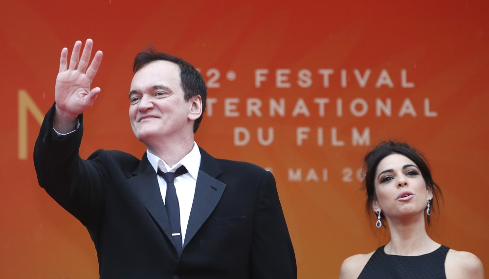 Director Quentin Tarantino and wife Daniella Pick pose. Reuters/Eric Gaillard