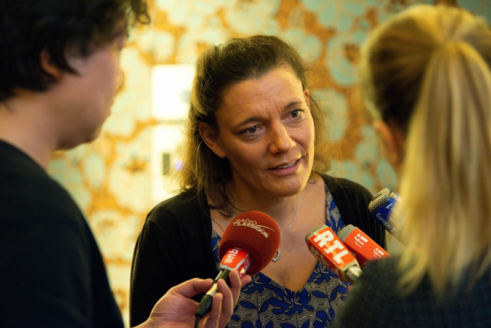 Nadege Dubois-Seex speaks with media representatives after a press conference in Paris on May 21, 2019, following hthe death of her husband Jonathan Seex, who was killed in an Ethiopian Airlines Boeing 737 Max 8 aircraft crash on March 10, 2019, on a flig