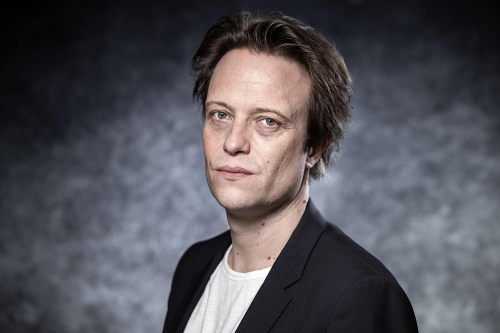 German actor August Diehl poses during a photo session during the 2nd edition of the Cannes International Series Festival (Canneseries) in Cannes, southern France on April 8, 2019 . AFP / Joel Saget 