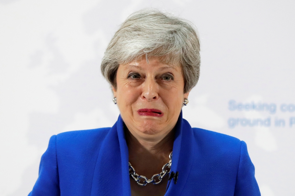 Britain's Prime Minister Theresa May grimaces during her speech on Brexit in London, Britain May 21, 2019. Kirsty Wigglesworth/Pool via REUTERS