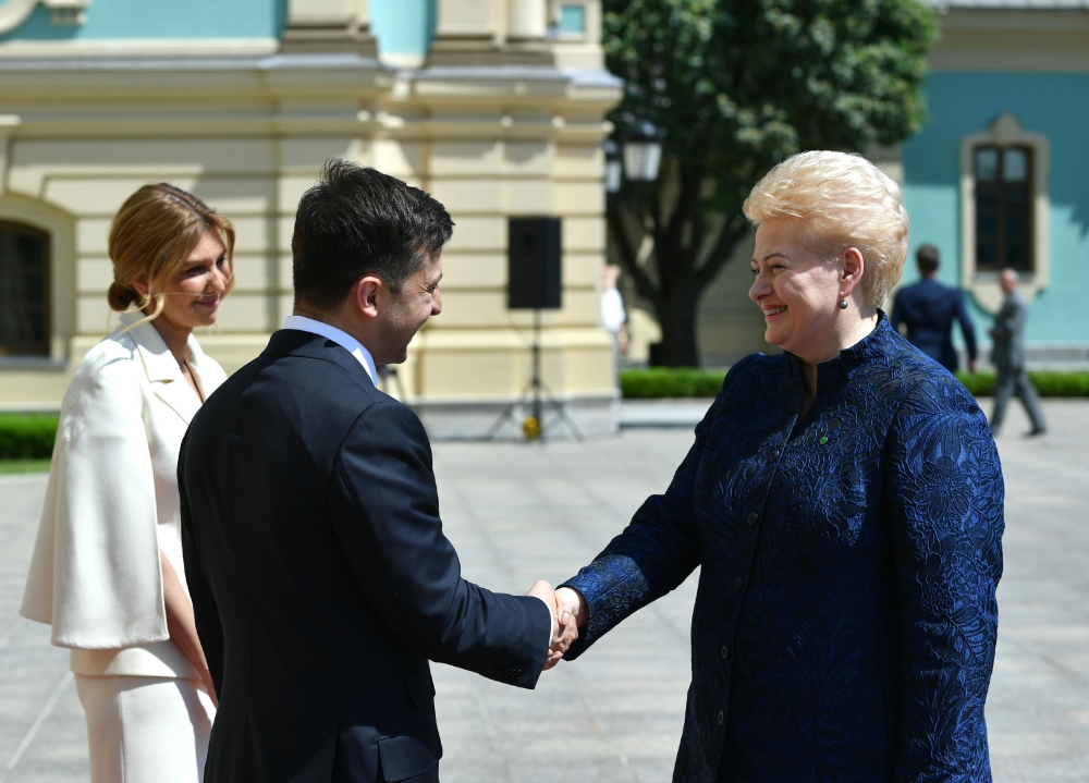 Ukraine's President Volodymyr Zelensky (2nd L) shakes hands with President of Lithuania, Dalia Grybauskaite (R) following his inauguration ceremony at the Ukrainian Parliament in Kiev, Ukraine on May 20, 2019. 