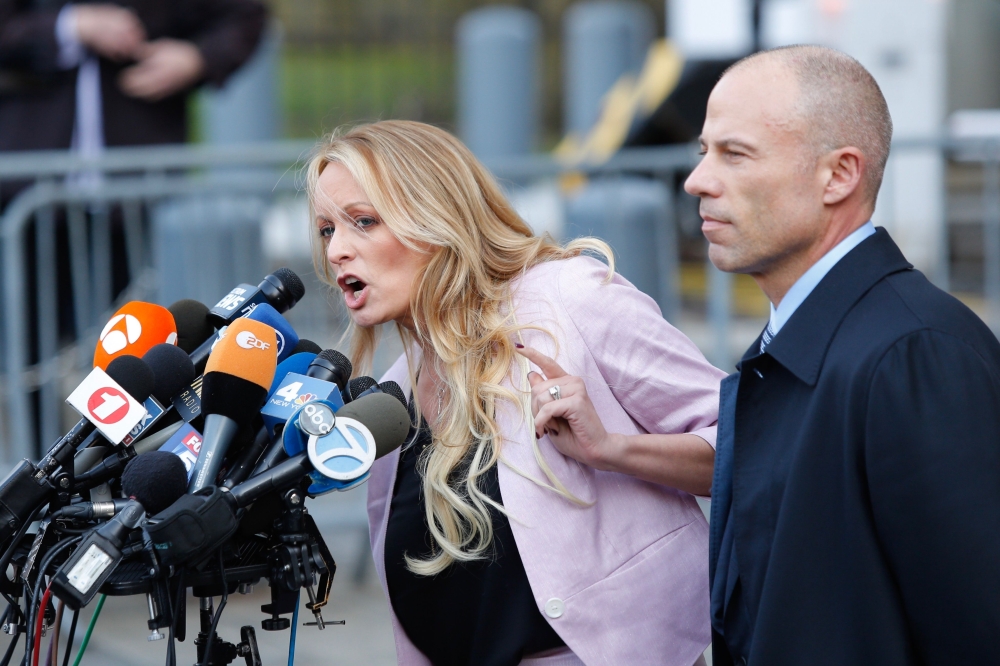 Stephanie Clifford also known as Stormy Daniels speaks outside US Federal Court with her lawyer Michael Avenatti in Lower Manhattan on April 16, 2018. AFP/Eduardo Munoz Alvarez