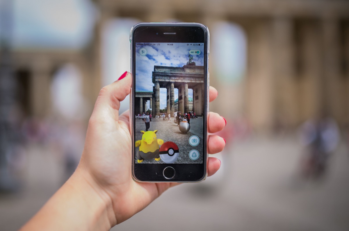 REPRESENTATIVE IMAGE: A woman points her smart phone at the Brandenburg Gate as she plays the Pokemon Go mobile game in Berlin on July 13, 2016. AFP