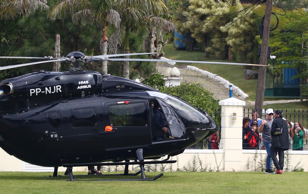 Brazil's Neymar arrives by helicopter at the training ground REUTERS/Pilar Olivares