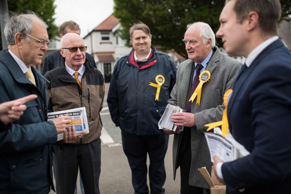 East Midlands Liberal Democrat candidate, Michael Mullaney, (R), councillor David Bill (2R) and Liberal Democrat volunteers prepare to canvass for support ahead of the forthcoming European parliamentary elections, in the town of Hinckley, central England 
