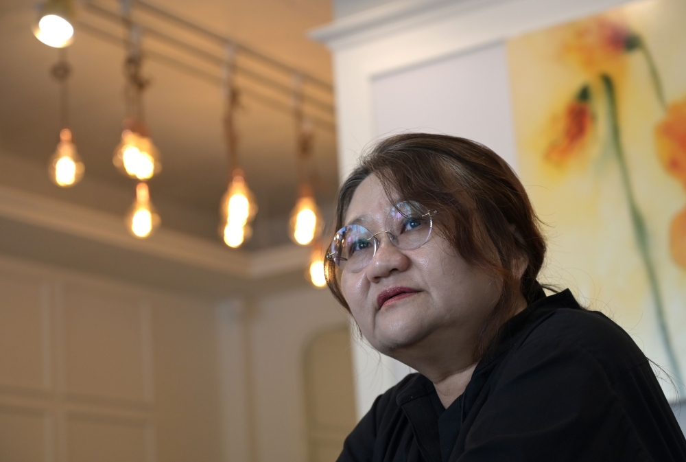 This picture taken on April 30, 2019 shows South Korean scholar and filmmaker Kim So-young speaking during an interview with AFP on her documentary titled 