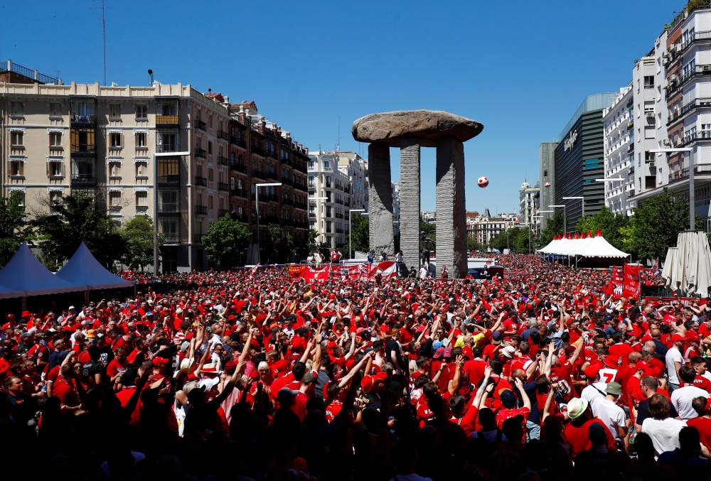General view of Liverpool fans playing with a ball in a fan zone REUTERS/Juan Medina
 
