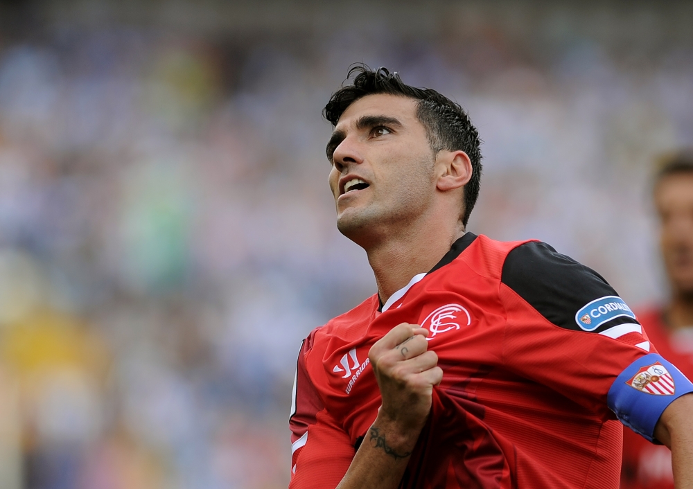 (FILES) In this file photo taken on May 23, 2015 Sevilla's then forward Jose Antonio Reyes celebrates a goal during the Spanish league football match Malaga CF vs Sevilla FC at La Rosaleda stadium in Malaga.  AFP / Cristina Quicler