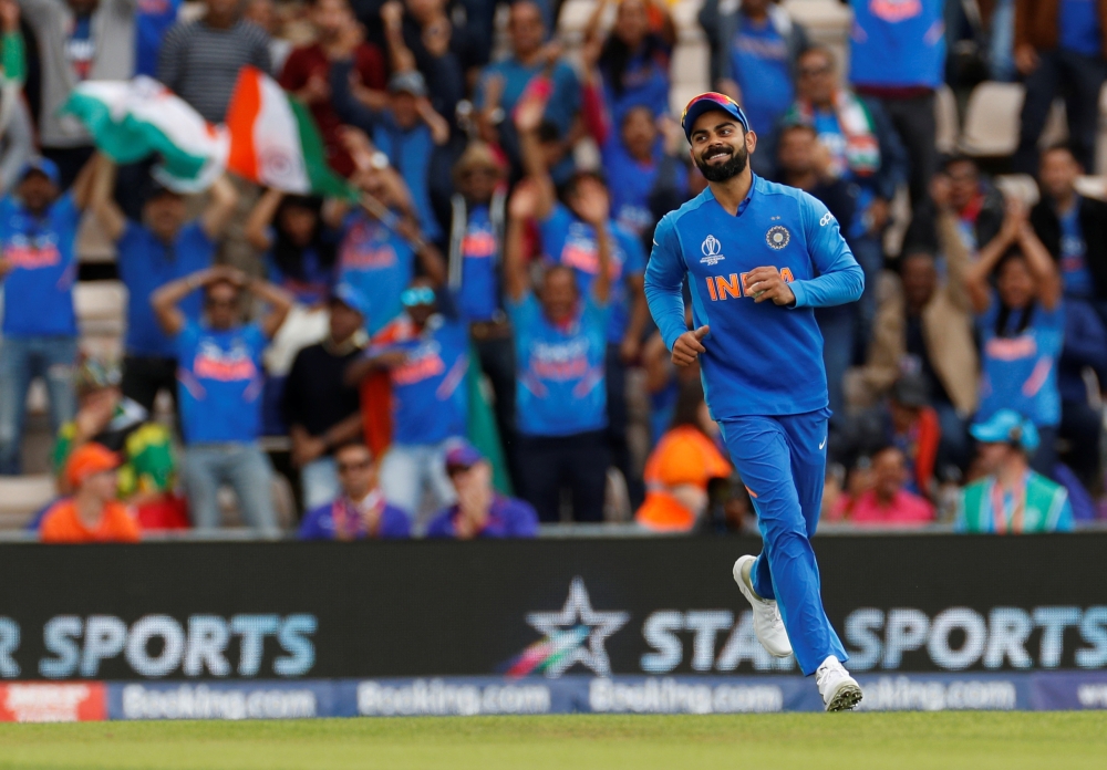 India's Virat Kohli celebrates taking a catch to dismiss South Africa's Quinton de Kock Action Images via Reuters/John Sibley