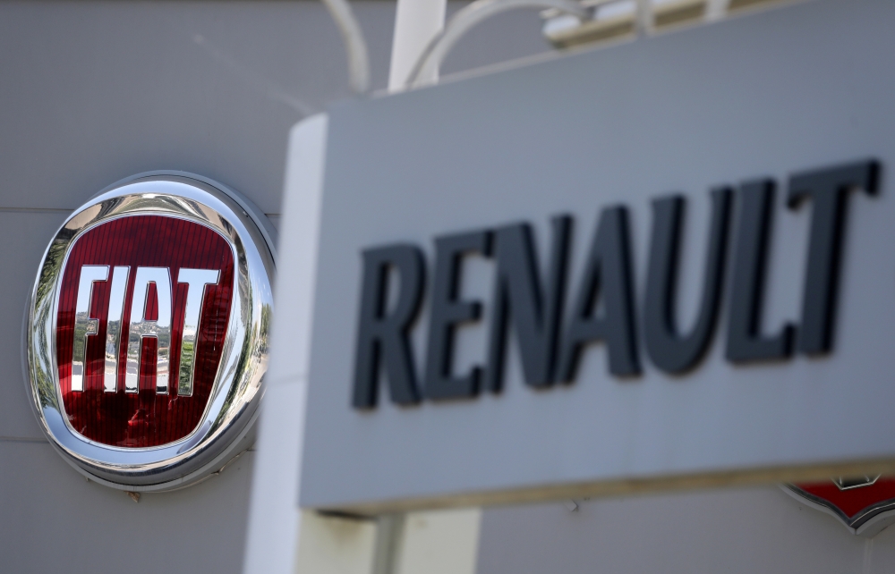 The logos of Renault and Fiat carmakers are seen in Nice, France, June 3, 2019. Reuters/Eric Gaillard