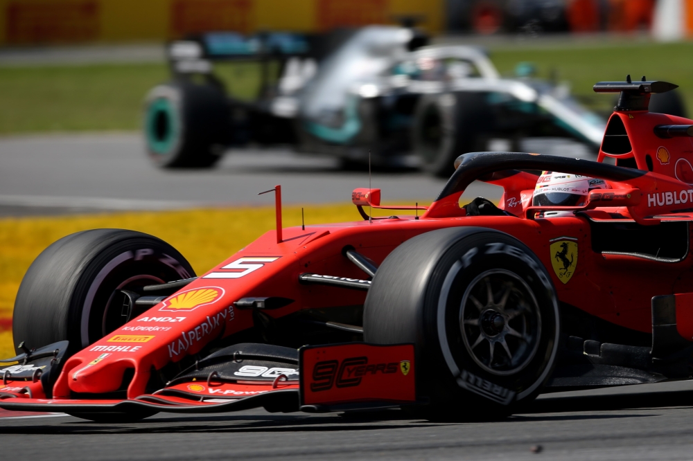 Sebastian Vettel of Germany driving the (5) Scuderia Ferrari SF90 leads Lewis Hamilton of Great Britain driving the (44) Mercedes AMG Petronas F1 Team Mercedes W10 on track during the F1 Grand Prix of Canada at Circuit Gilles Villeneuve on June 09, 2019 i