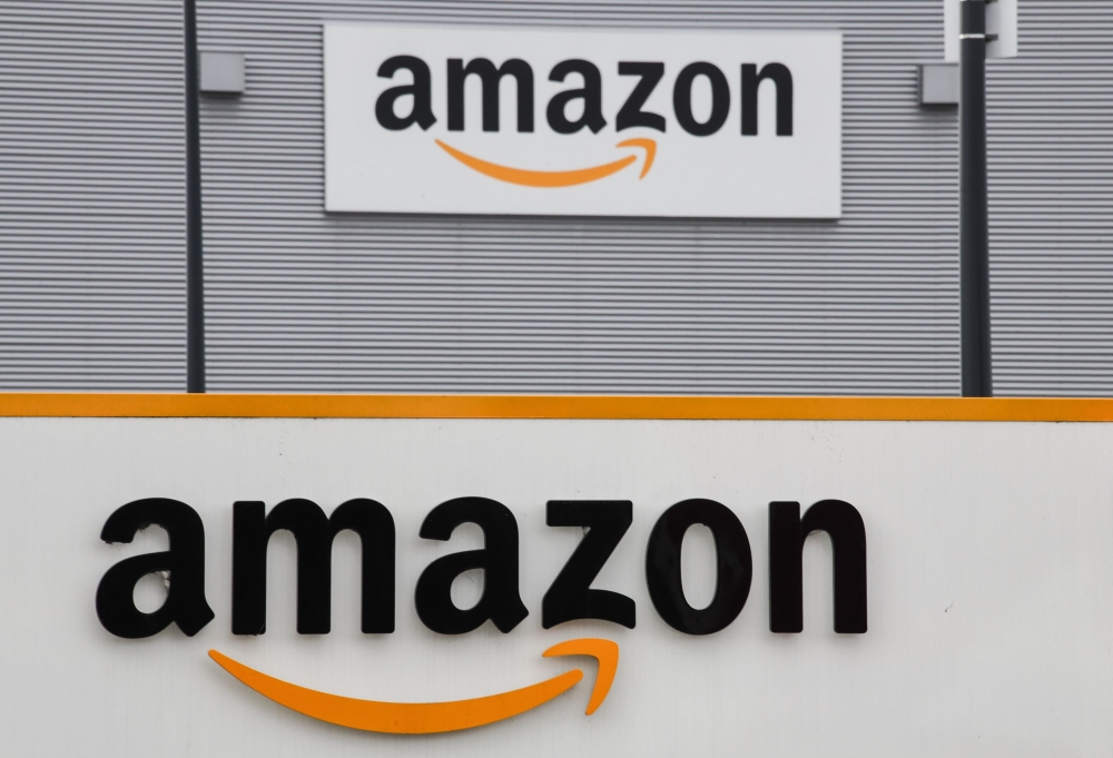 (FILES) In this file photo taken on March 04, 2019 shows the Amazon logo at the entrance area of the Amazon logistics centre in Lauwin-Planque, northern France. AFP / Denis Charlet 