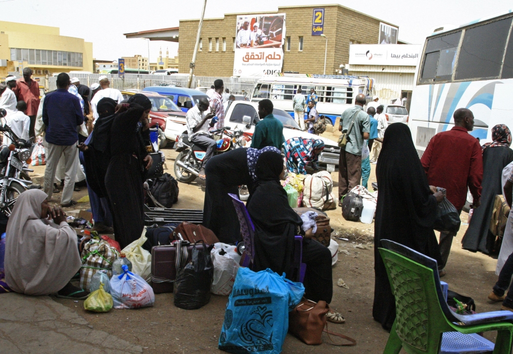 Passengers wait for their shuttle at the main bus station in Khartoum, linking the Sudanese capital with various parts of the country, on June 12, 2019.  AFP
 