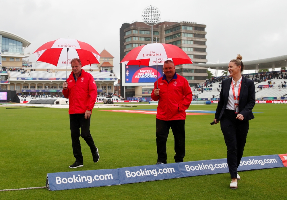 Umpires Marais Erasmus and Paul Reiffel after the match was abandoned Action Images via Reuters/Andrew Boyers