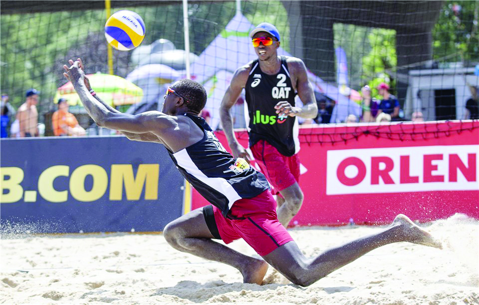 Qatar’s Cherif Younousse and Ahmed Tijan in action against USA’s Trevor Crabb and Tri Bourne during their second Pool G match at the FIVB Beach Volleyball World Tour, Warsaw event in Poland, yesterday.