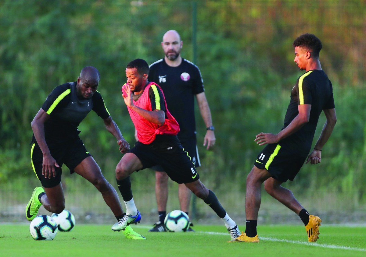 FROM LEFT: Qatar’s Abdelkarim Hassan, Pedro Miguel and Akram Afif in action as coach Felix Sanchez looks on during a training session in Rio de Janeiro on the eve of their opening match of the 2019 Copa America against Paraguay, which will be played at th