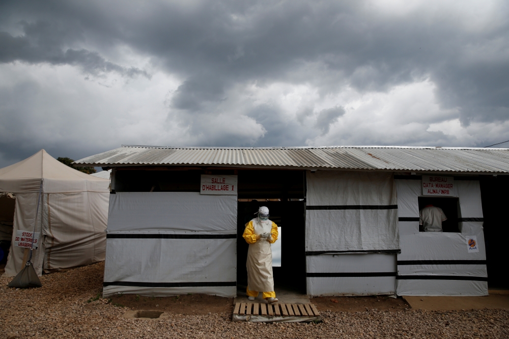 FILE PHOTO: A health worker wearing Ebola protection gear, leaves the dressing room before entering the Biosecure Emergency Care Unit (CUBE) at the ALIMA (The Alliance for International Medical Action) Ebola treatment centre in Beni, in the Democratic Rep
