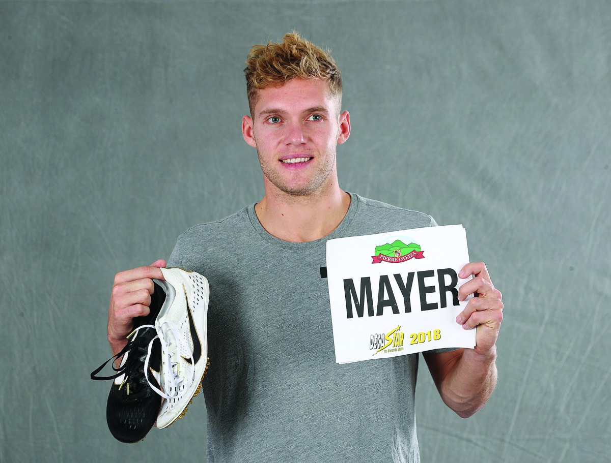 Kevin Mayer shows the shoes and the bib he wore when he set the decathlon world record for the decathlon during the Decaster meeting in Talence, France, on September 16, 2018. Mayer yesterday donated the kit to the IAAF Heritage World Athletics Championsh
